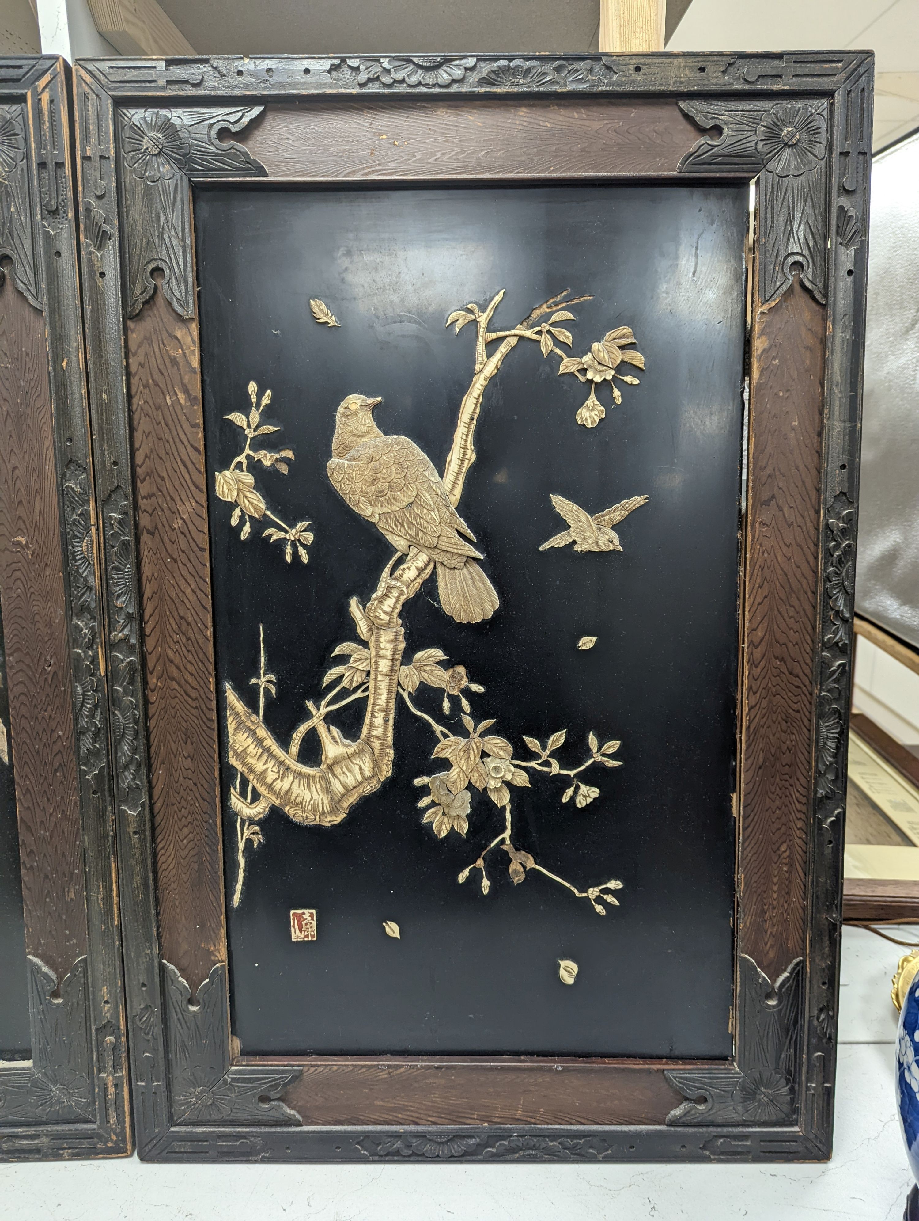 A pair of Japanese carved bone lacquer ground rectangular plaques, height 74cm